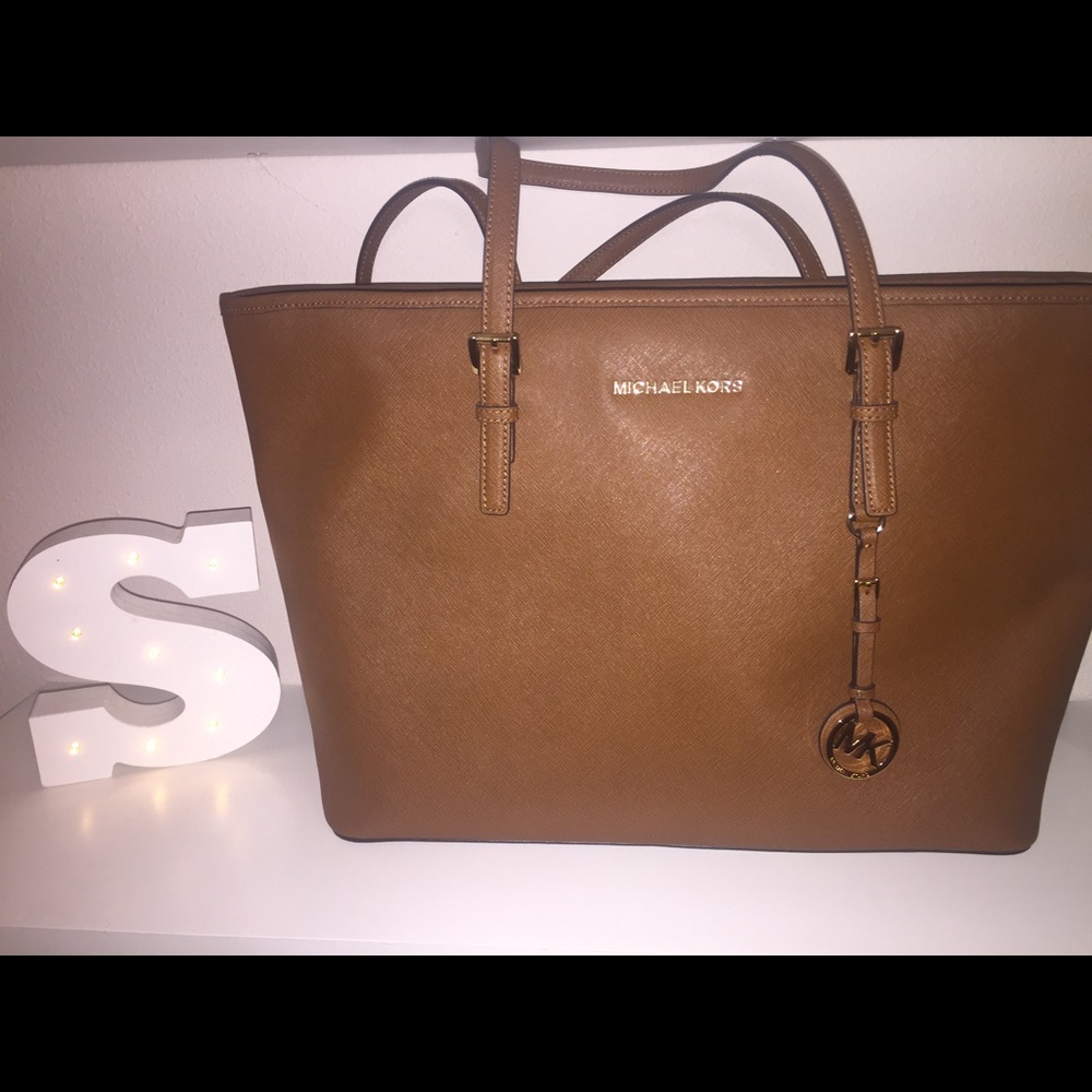 MK Jet Set Travel Medium Top-zip tote.